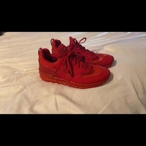 Selling red tennis shoes